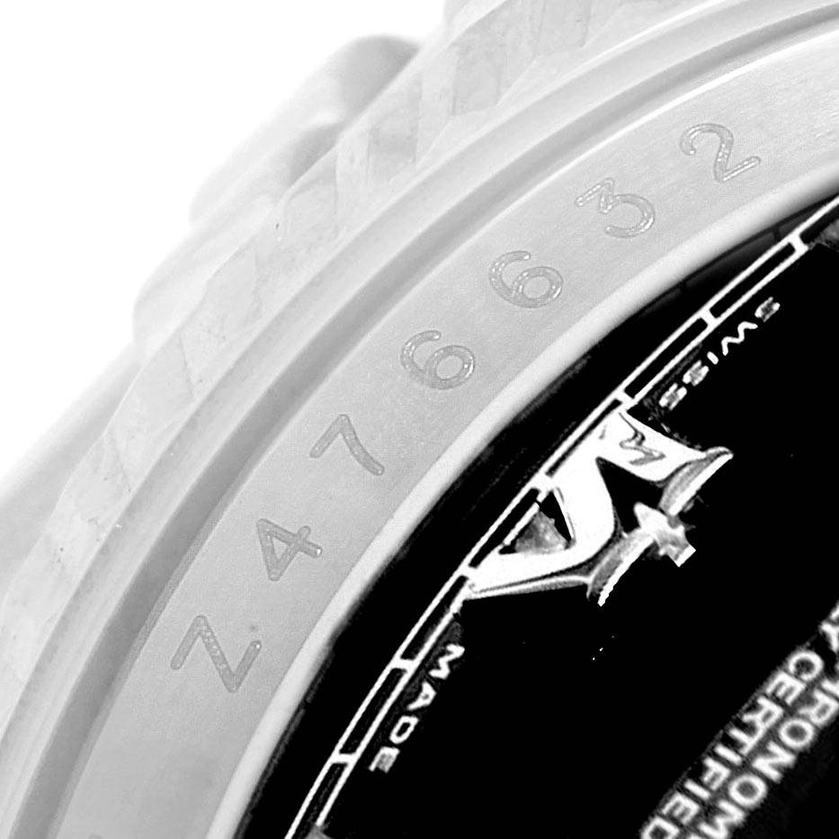 The image shows a close-up of the serial number and part of the rehaut on a Rolex Datejust 116234 Men's Stainless Steel Black Dial 116234 Men's Stainless Steel Black Dial model.