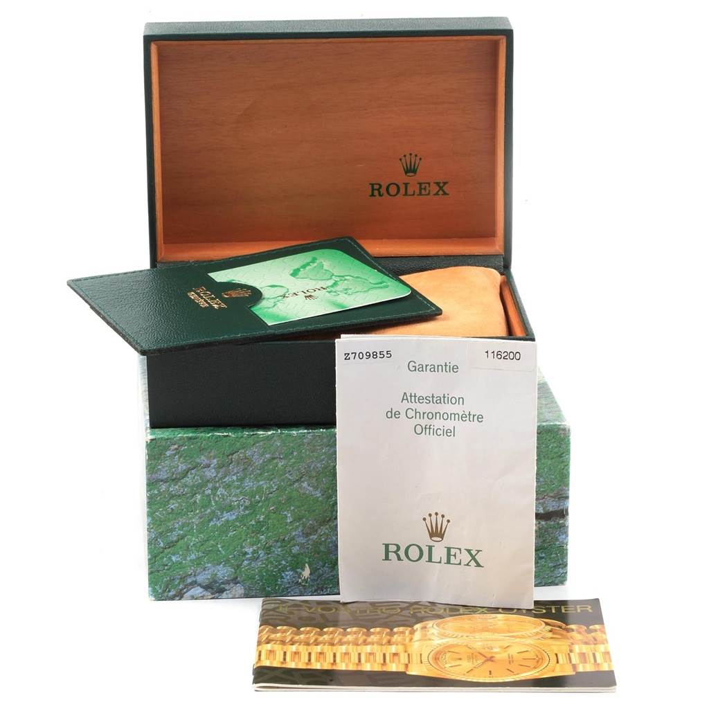 The image shows the packaging and documentation for a Rolex Datejust 116200 Men's Stainless Steel Blue Dial 116200 Men's Stainless Steel Blue Dial model, including the box, warranty card, and booklets.