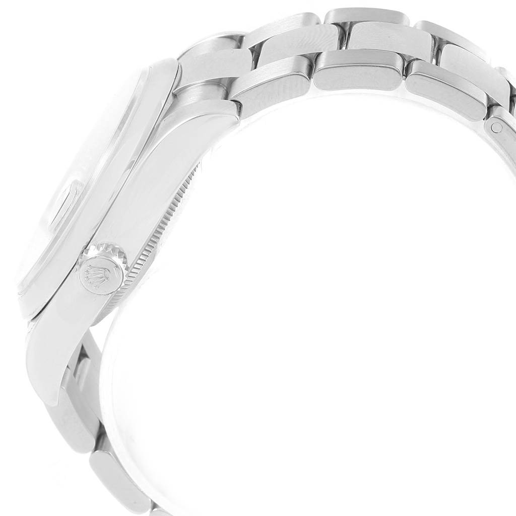 This side view of the Rolex Datejust 116200 Men's Stainless Steel Blue Dial 116200 Men's Stainless Steel Blue Dial watch showcases the crown, bezel, case, and part of the bracelet.