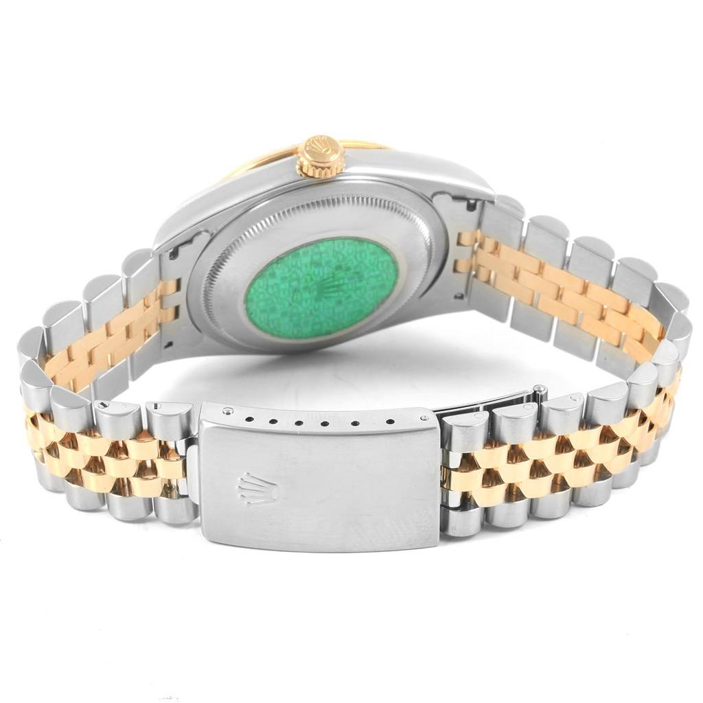 The image shows the back and clasp of a Rolex Datejust 16233 Men's Steel and Gold (two tone) Black Dial 16233 Men's Steel and Gold (two tone) Black Dial watch, highlighting its two-tone metal bracelet.