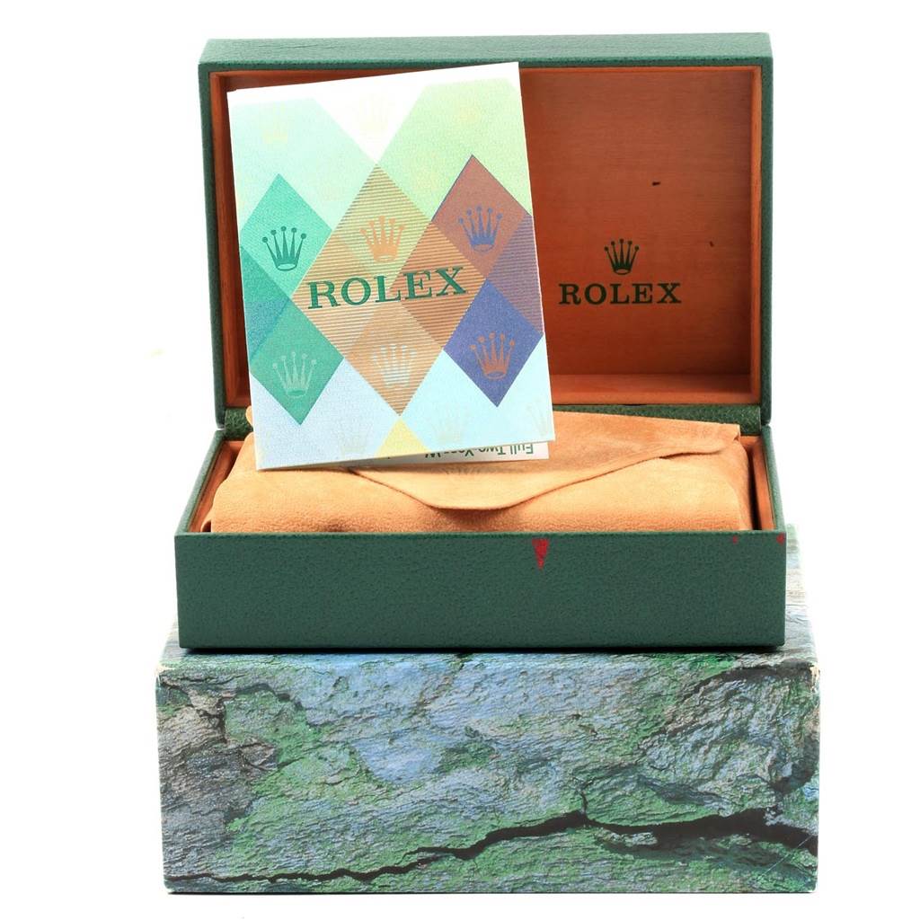 The image shows a Rolex Datejust 16233 Men's Steel and Gold (two tone) Black Dial 16233 Men's Steel and Gold (two tone) Black Dial watch box with a booklet and a protective cover pouch inside, viewed from the front.