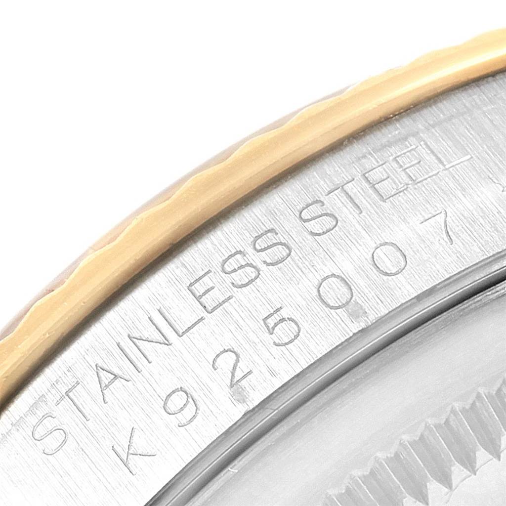 This close-up image shows the side view of the stainless steel case and bezel of a Rolex Datejust 16233 Men's Steel and Gold (two tone) Black Dial 16233 Men's Steel and Gold (two tone) Black Dial watch.