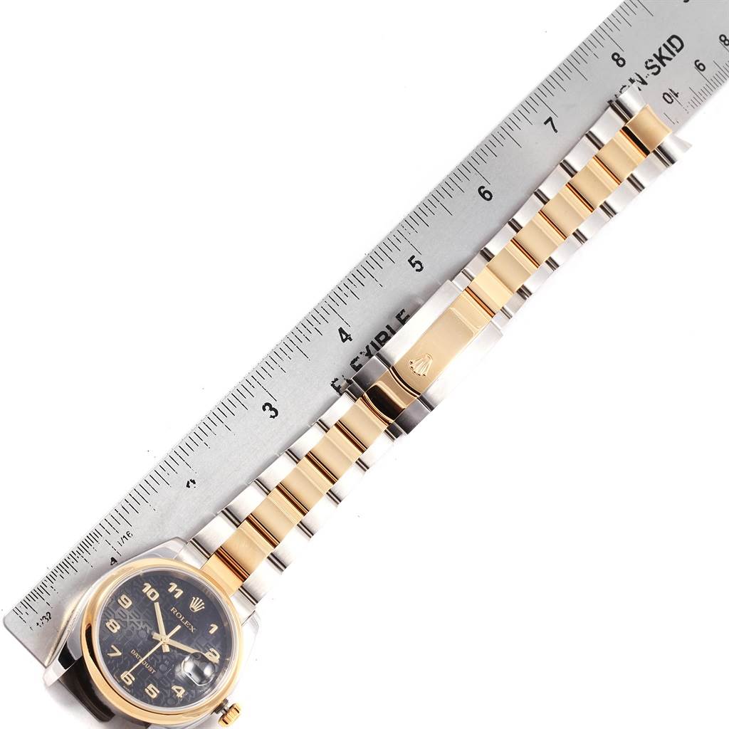 The image shows a Rolex Datejust 116203 Men's Stainless Steel Black Dial 116203 Men's Stainless Steel Black Dial watch from a top-down view, with the face and bracelet extended alongside a ruler.