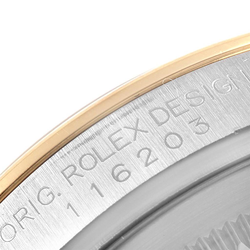 The image shows a close-up of the case back and part of the edge of a Rolex Datejust 116203 Men's Stainless Steel Black Dial 116203 Men's Stainless Steel Black Dial watch, highlighting the engraving.