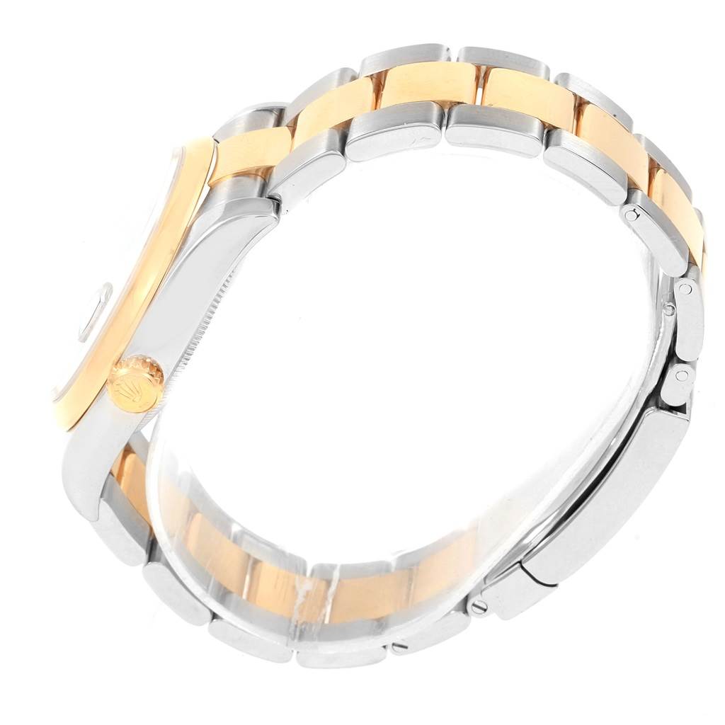 This image shows a side view of a Rolex Datejust 116203 Men's Stainless Steel Black Dial 116203 Men's Stainless Steel Black Dial watch, highlighting its two-tone bracelet and crown.