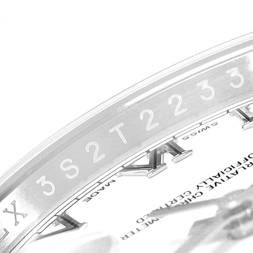 This is a close-up image of the bezel and part of the dial of a Rolex Datejust 392T2233 Men
s Stainless Steel White Dial 392T2233 Men
s Stainless Steel White Dial watch.