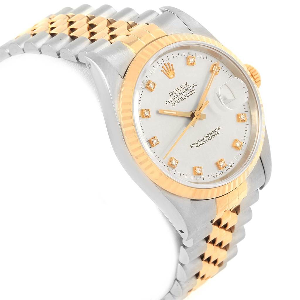 This image shows a side-angle view of a Rolex Datejust 16233 Men's Steel and Gold (two tone) Silver Dial 16233 Men's Steel and Gold (two tone) Silver Dial watch, highlighting its two-tone bracelet, bezel, and face with diamond markers.
