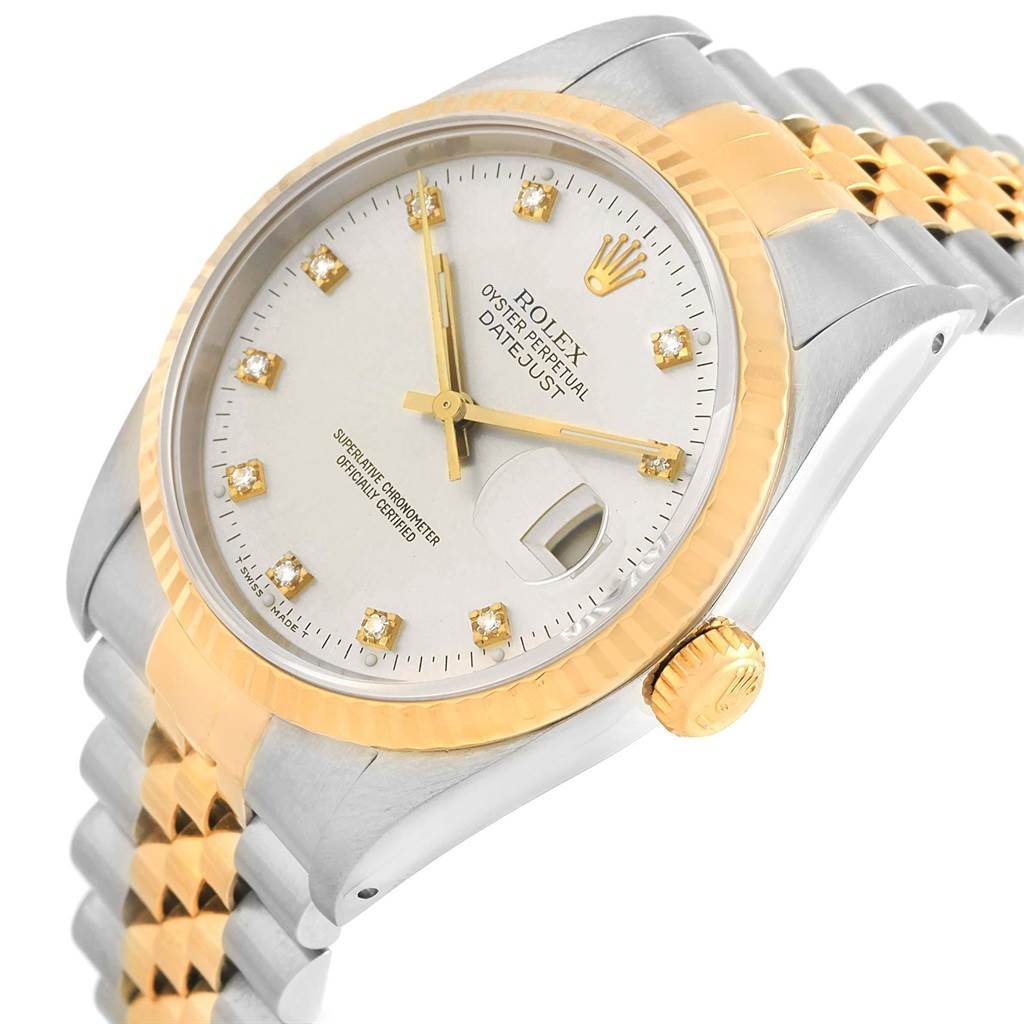 The image shows a Rolex Datejust 16233 Men's Steel and Gold (two tone) Silver Dial 16233 Men's Steel and Gold (two tone) Silver Dial watch at an angle, highlighting its gold fluted bezel, dial, and two-tone bracelet.