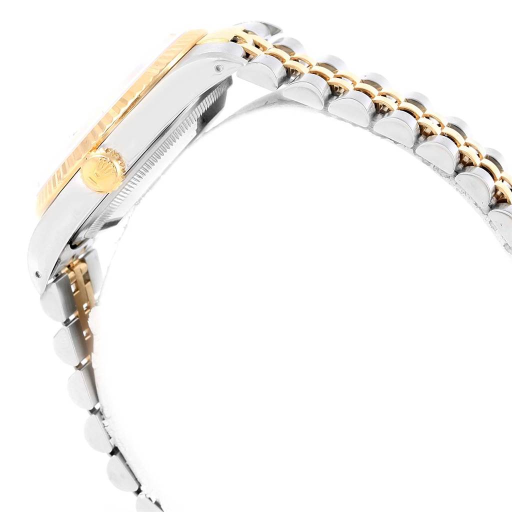 This side view showcases the crown, bezel, and part of the bracelet of the Rolex Datejust 16233 Men's Steel and Gold (two tone) Silver Dial 16233 Men's Steel and Gold (two tone) Silver Dial watch.