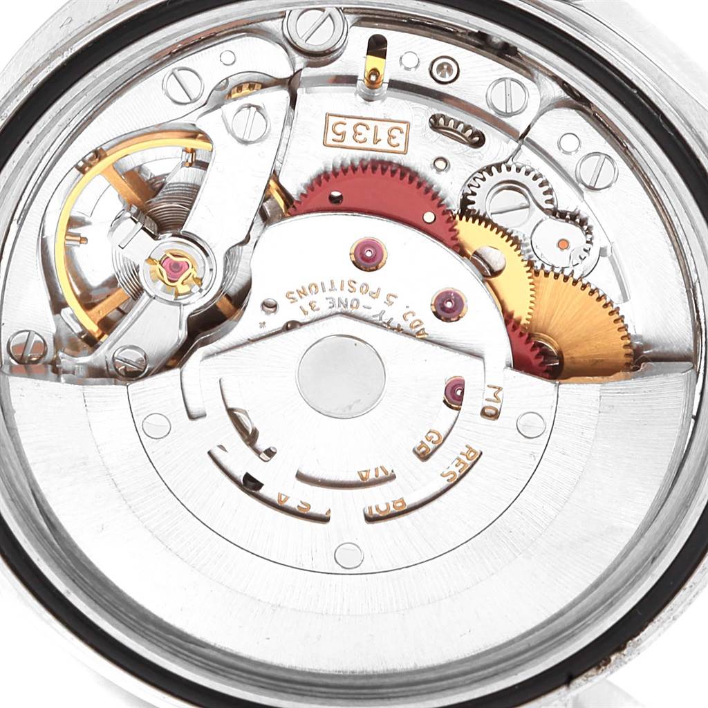 The image shows the movement mechanism of a Rolex Datejust 16233 Men's Steel and Gold (two tone) Silver Dial 16233 Men's Steel and Gold (two tone) Silver Dial watch from a rear, close-up angle.