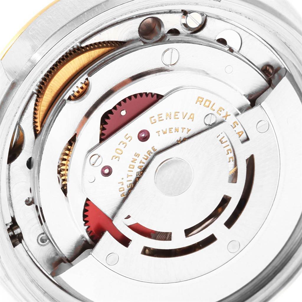 The image shows a close-up view of the Rolex Datejust 16013 Men
s Stainless Steel Champagne Dial 16013 Men
s Stainless Steel Champagne Dial
s movement, highlighting its intricate internal components.