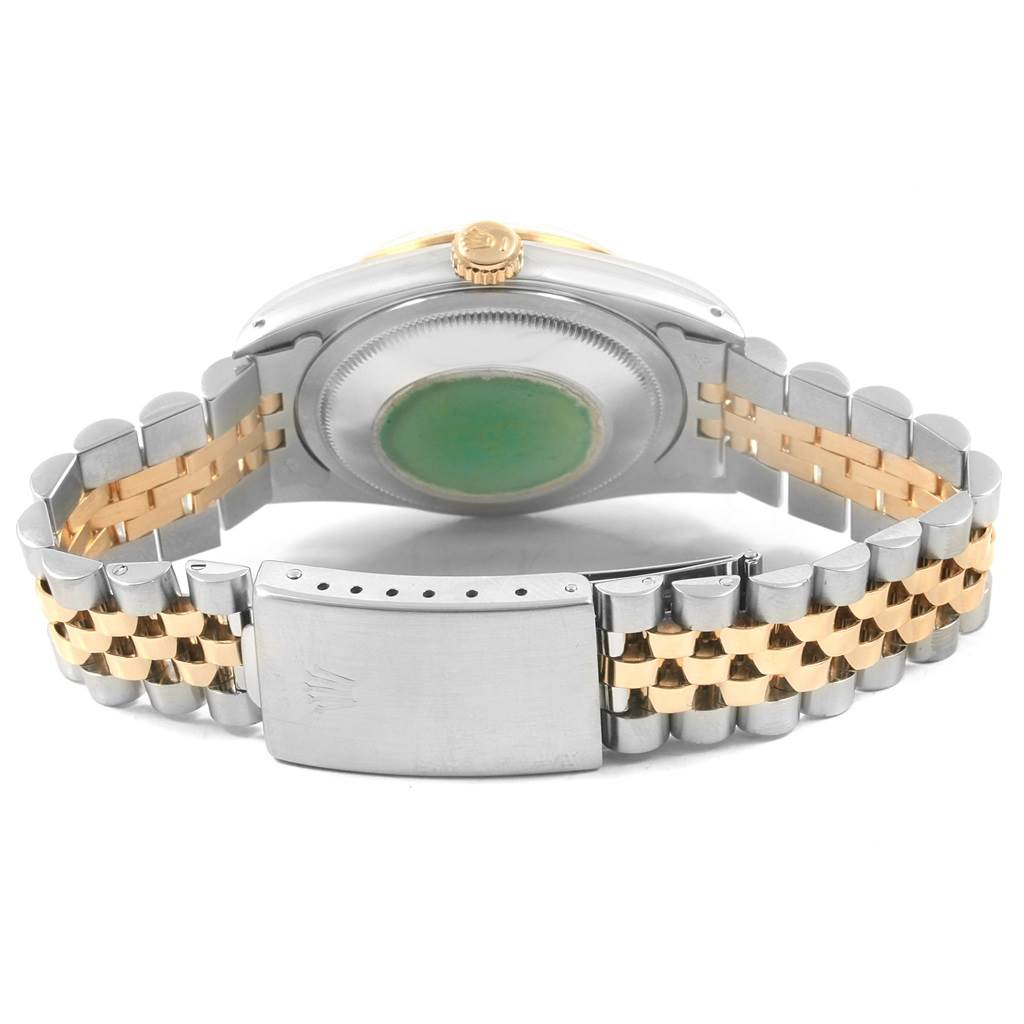 This Rolex Datejust 16233 Men's Steel and Gold (two tone) White Dial 16233 Men's Steel and Gold (two tone) White Dial watch is shown from the back, highlighting its case back, crown, and two-tone Jubilee bracelet.