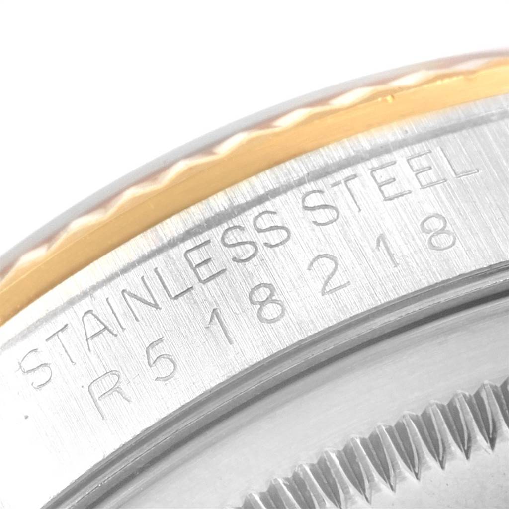 The image shows a close-up of the edge and engraved text on the bezel and case of a Rolex Datejust 16233 Men's Steel and Gold (two tone) Champagne Dial 16233 Men's Steel and Gold (two tone) Champagne Dial watch.