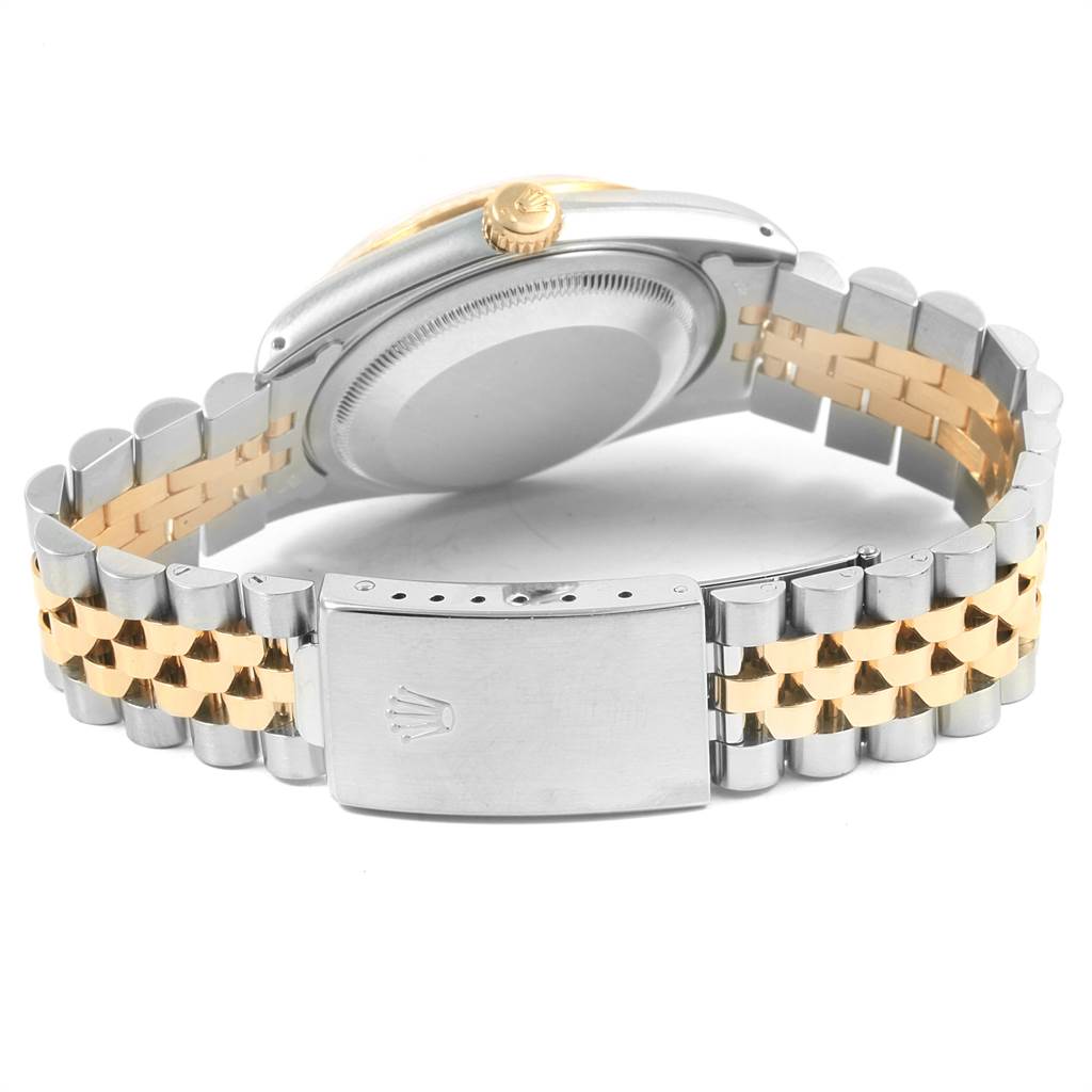 This image shows the backside and bracelet of a Rolex Datejust 16233 Men's Steel and Gold (two tone) Champagne Dial 16233 Men's Steel and Gold (two tone) Champagne Dial watch, highlighting its clasp and jubilee bracelet.