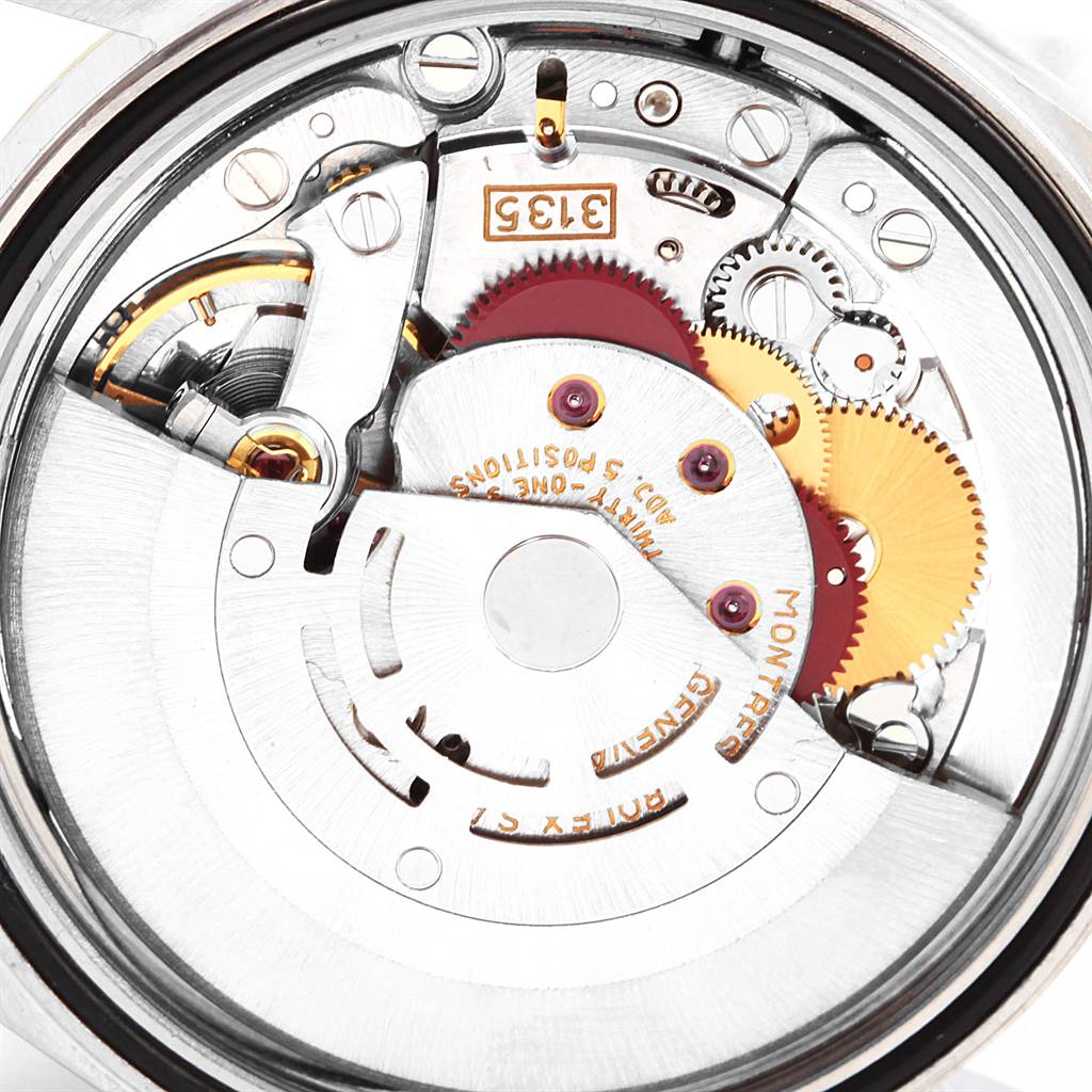 This image shows the intricate inner mechanism of a Rolex Datejust 16233 Men's Steel and Gold (two tone) Champagne Dial 16233 Men's Steel and Gold (two tone) Champagne Dial watch from a top-down angle.