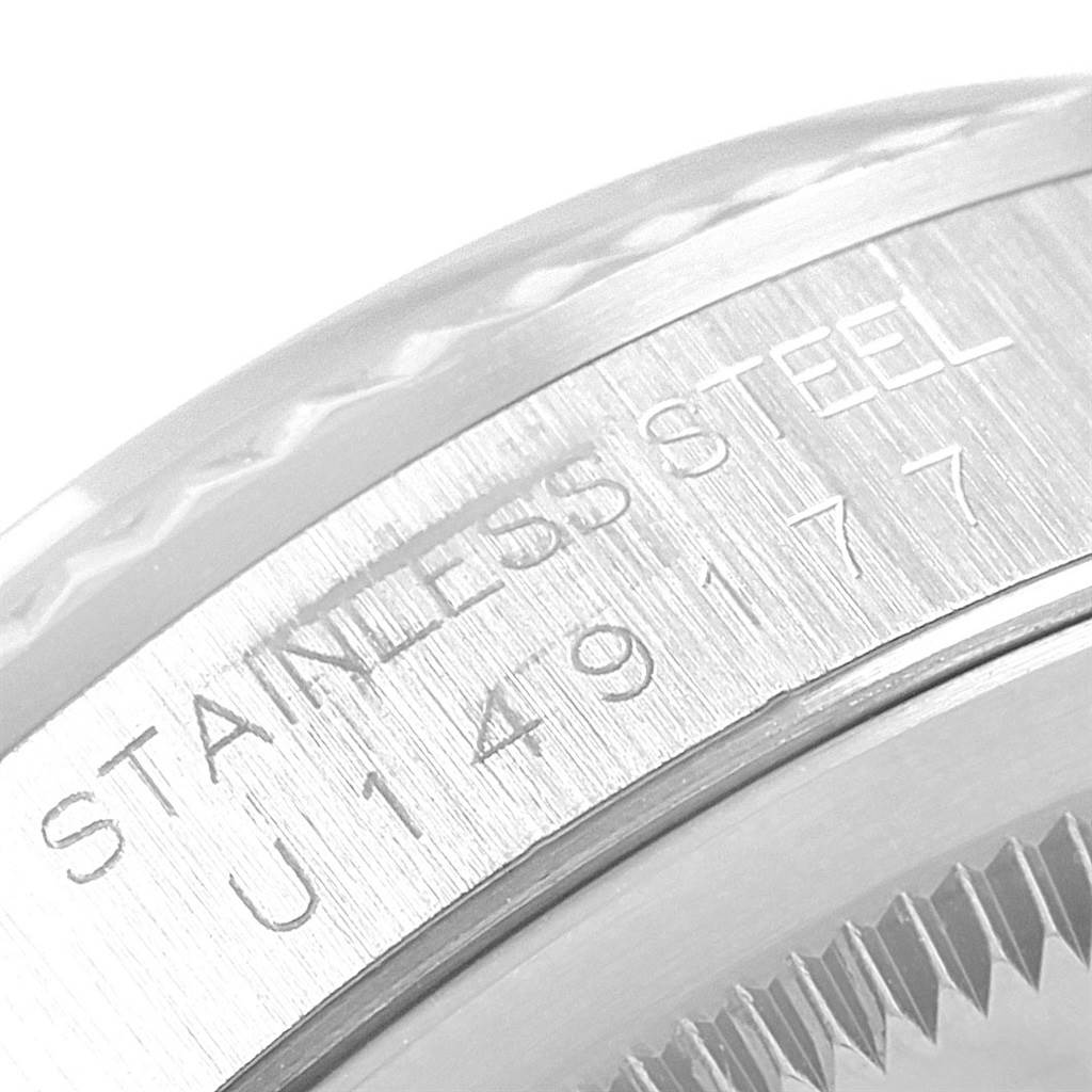 The image shows a close-up of the stainless steel case back and engraving of a Rolex Datejust 16234 Men
s Stainless Steel Silver Dial 16234 Men
s Stainless Steel Silver Dial watch.