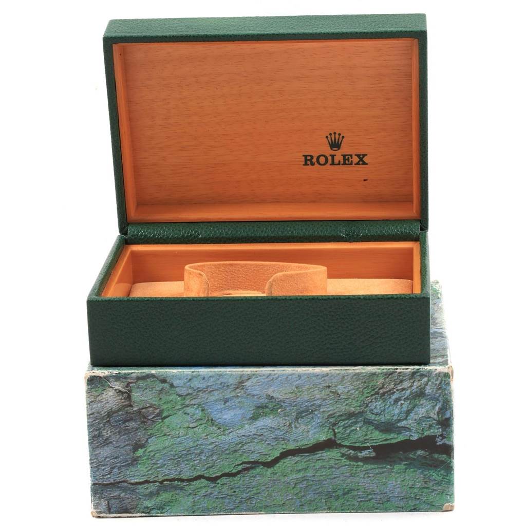 The image shows an open Rolex Datejust 16234 Men
s Stainless Steel Silver Dial 16234 Men
s Stainless Steel Silver Dial green and wood watch box with the Rolex logo inside.