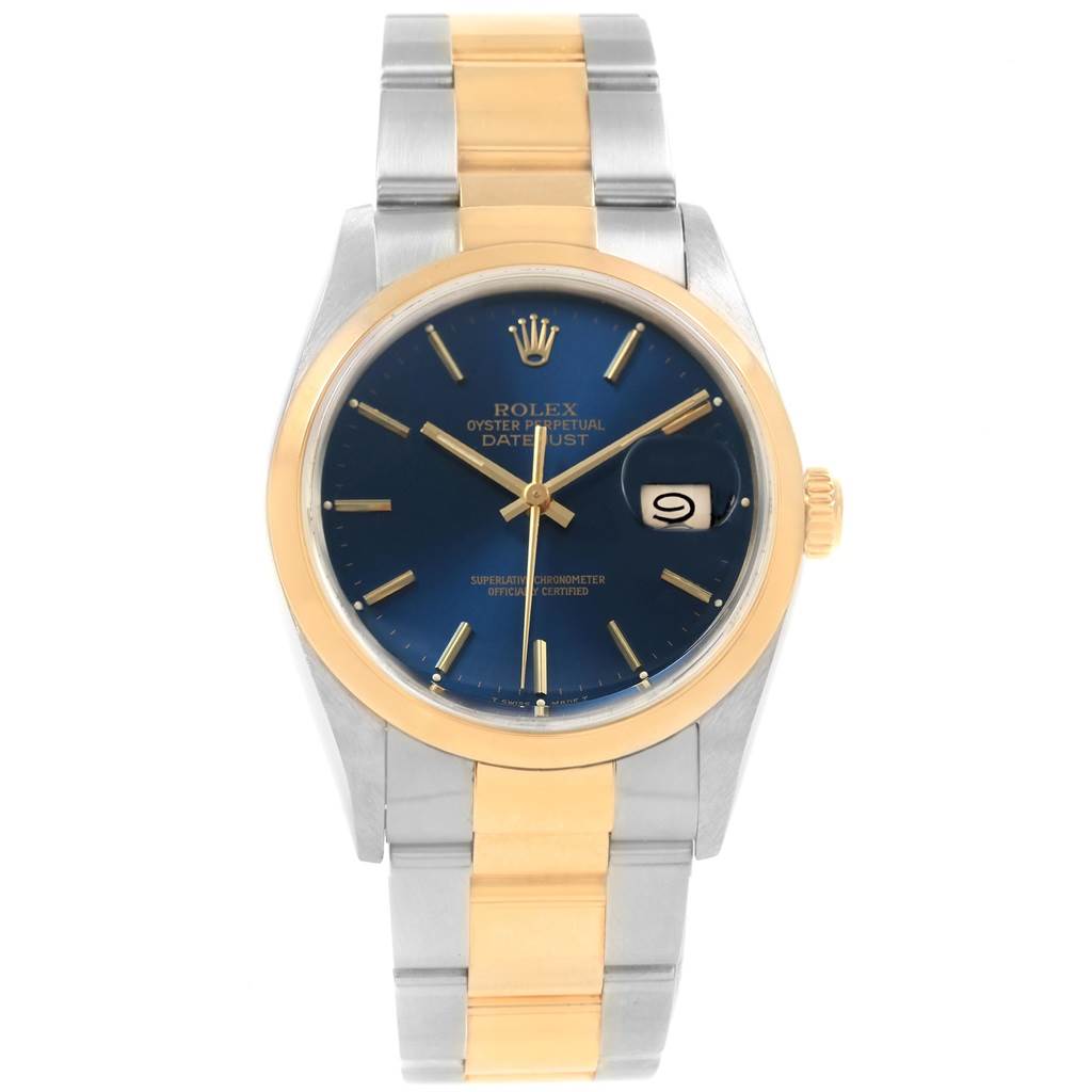 This image shows the face and bracelet of a Rolex Datejust 16203 Men's Steel and Gold (two tone) Blue Dial 16203 Men's Steel and Gold (two tone) Blue Dial watch with a blue dial, gold bezel, and bicolor metal strap.