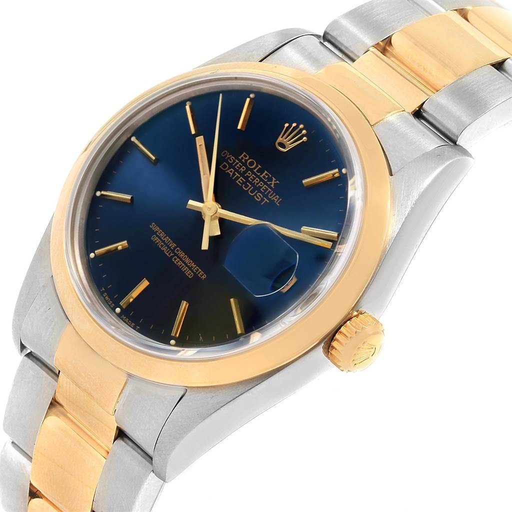 This image shows a close-up angled view of a Rolex Datejust 16203 Men's Steel and Gold (two tone) Blue Dial 16203 Men's Steel and Gold (two tone) Blue Dial watch, highlighting its face, crown, and bracelet.
