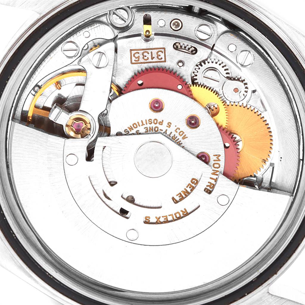 This image shows the movement of a Rolex Datejust 16233 Men's Steel and Gold (two tone) Champagne Dial 16233 Men's Steel and Gold (two tone) Champagne Dial watch, viewed from the back case, displaying gears and internal mechanisms.