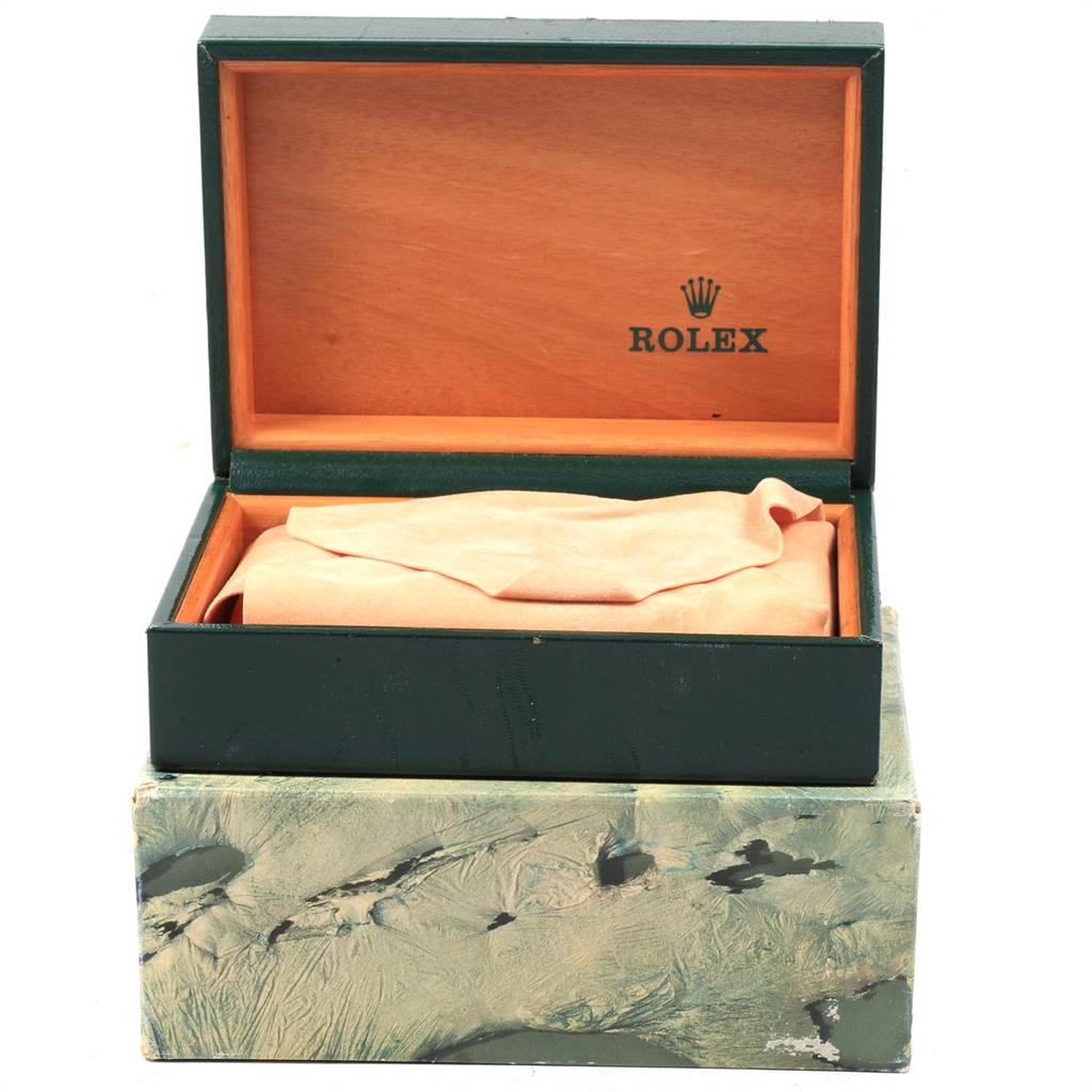 The image shows the open box of a Rolex Datejust 16233 Men's Steel and Gold (two tone) Champagne Dial 16233 Men's Steel and Gold (two tone) Champagne Dial watch, showcasing the interior logo and cushion.