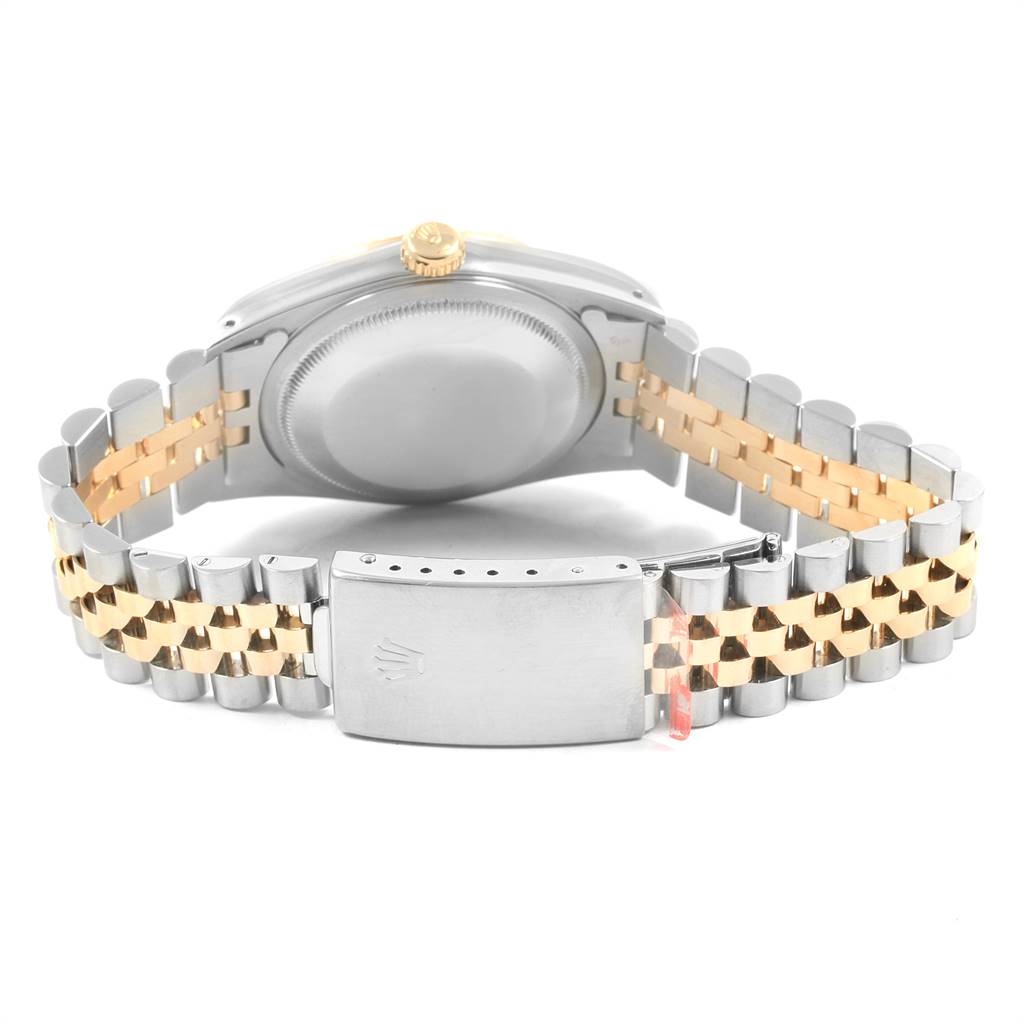 This image shows the back view of a Rolex Datejust 16233 Men's Steel and Gold (two tone) Champagne Dial 16233 Men's Steel and Gold (two tone) Champagne Dial watch, highlighting its case back and two-tone bracelet with the clasp.