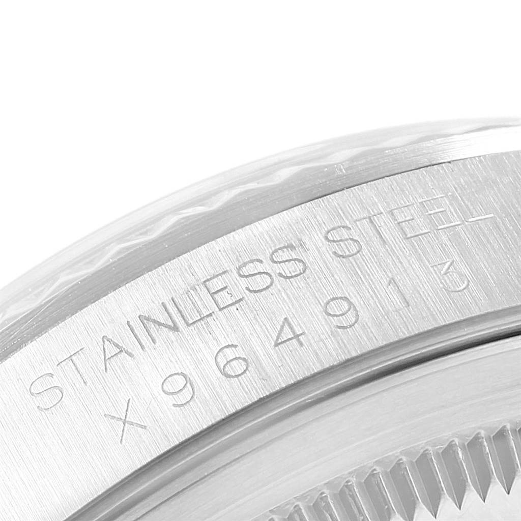 This image shows a close-up of the case back and the serial number engraving on a Rolex Datejust 16234 Men
s Stainless Steel Silver Dial 16234 Men
s Stainless Steel Silver Dial watch.