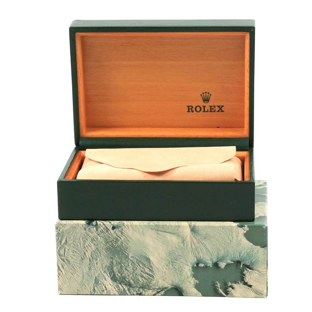 The image shows an open Rolex Datejust 16234 Men
s Stainless Steel Silver Dial 16234 Men
s Stainless Steel Silver Dial watch box, revealing its cushioned interior and wooden lining.