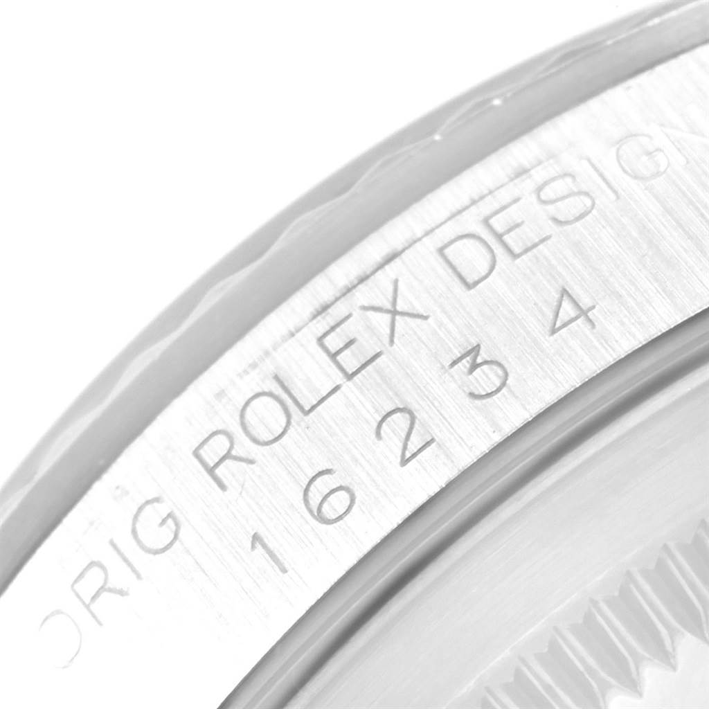 The image shows a close-up of the case back and engraving on a Rolex Datejust 16234 Men
s Stainless Steel Silver Dial 16234 Men
s Stainless Steel Silver Dial watch.