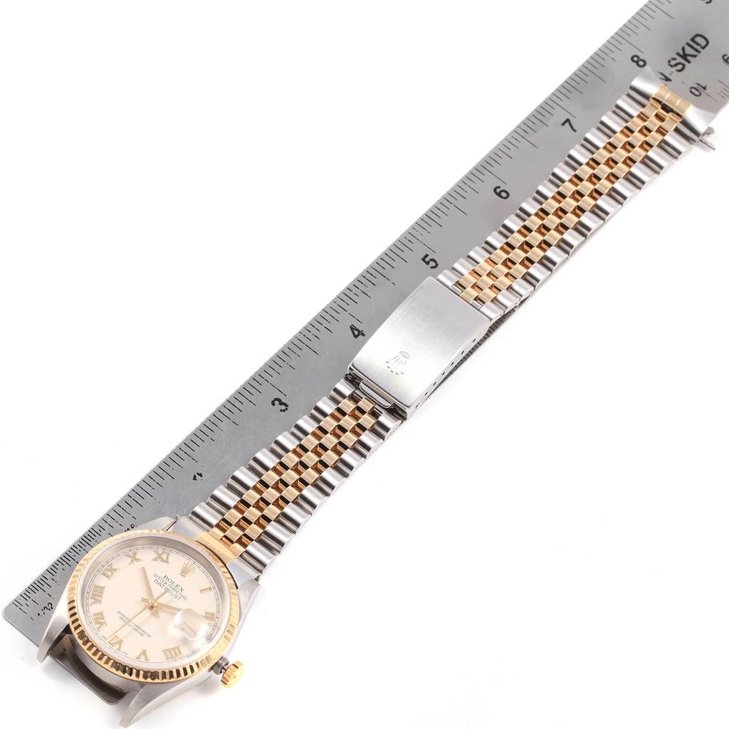 The image shows a Rolex Datejust 16233 Men's Steel and Gold (two tone) Beige Dial 16233 Men's Steel and Gold (two tone) Beige Dial watch laid flat with a ruler beside it, showcasing its face, band, and clasp.