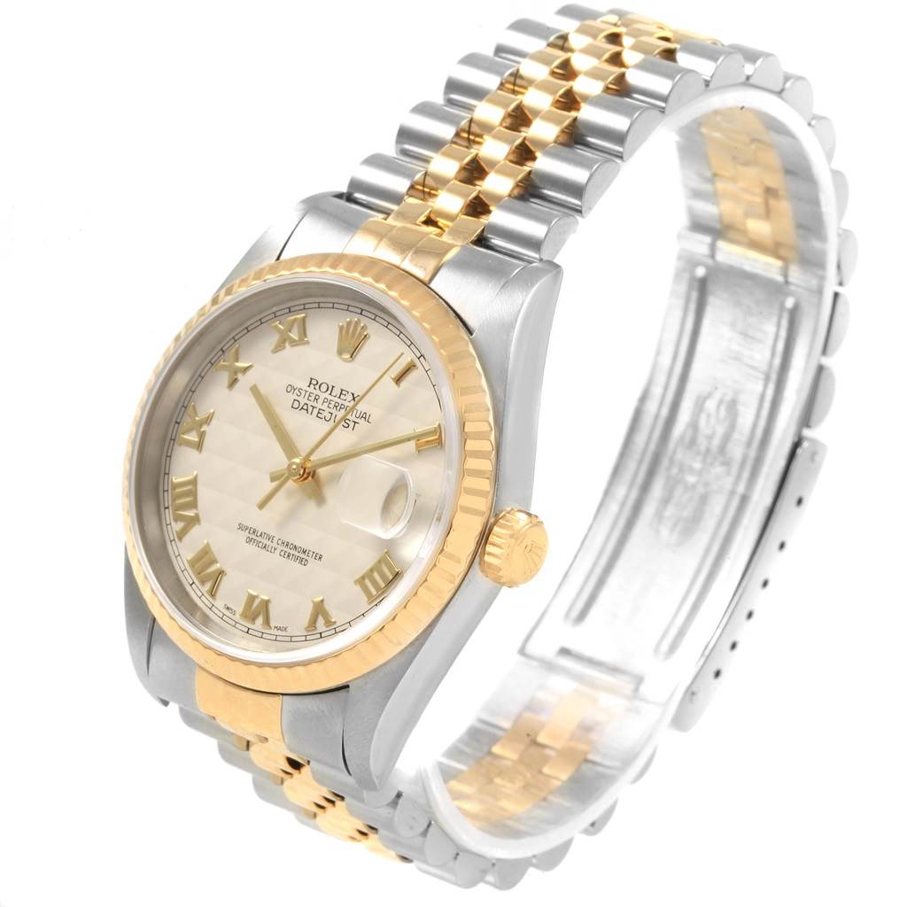 This image shows a Rolex Datejust 16233 Men's Steel and Gold (two tone) Beige Dial 16233 Men's Steel and Gold (two tone) Beige Dial watch from a slight side angle, featuring its two-tone bracelet, fluted bezel, and white dial with Roman numerals.