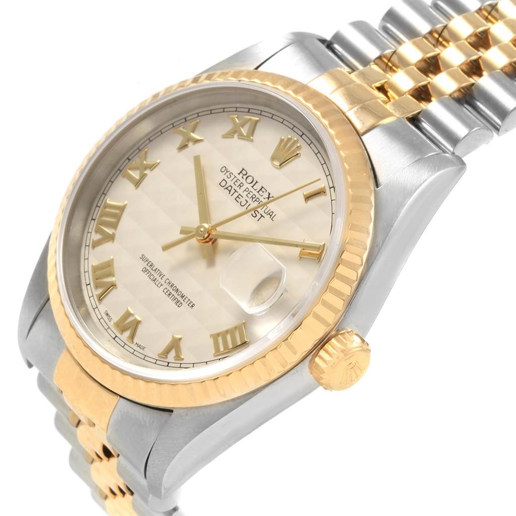 The image shows a close-up, angled view of the Rolex Datejust 16233 Men's Steel and Gold (two tone) Beige Dial 16233 Men's Steel and Gold (two tone) Beige Dial watch, featuring the face, fluted bezel, crown, and part of the bracelet.