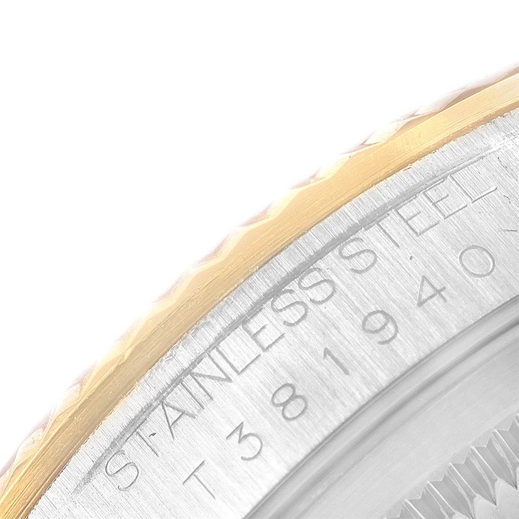 The image shows a close-up of the Rolex Datejust 16233 Men's Steel and Gold (two tone) Beige Dial 16233 Men's Steel and Gold (two tone) Beige Dial model's bezel and inner case with visible serial number engravings.