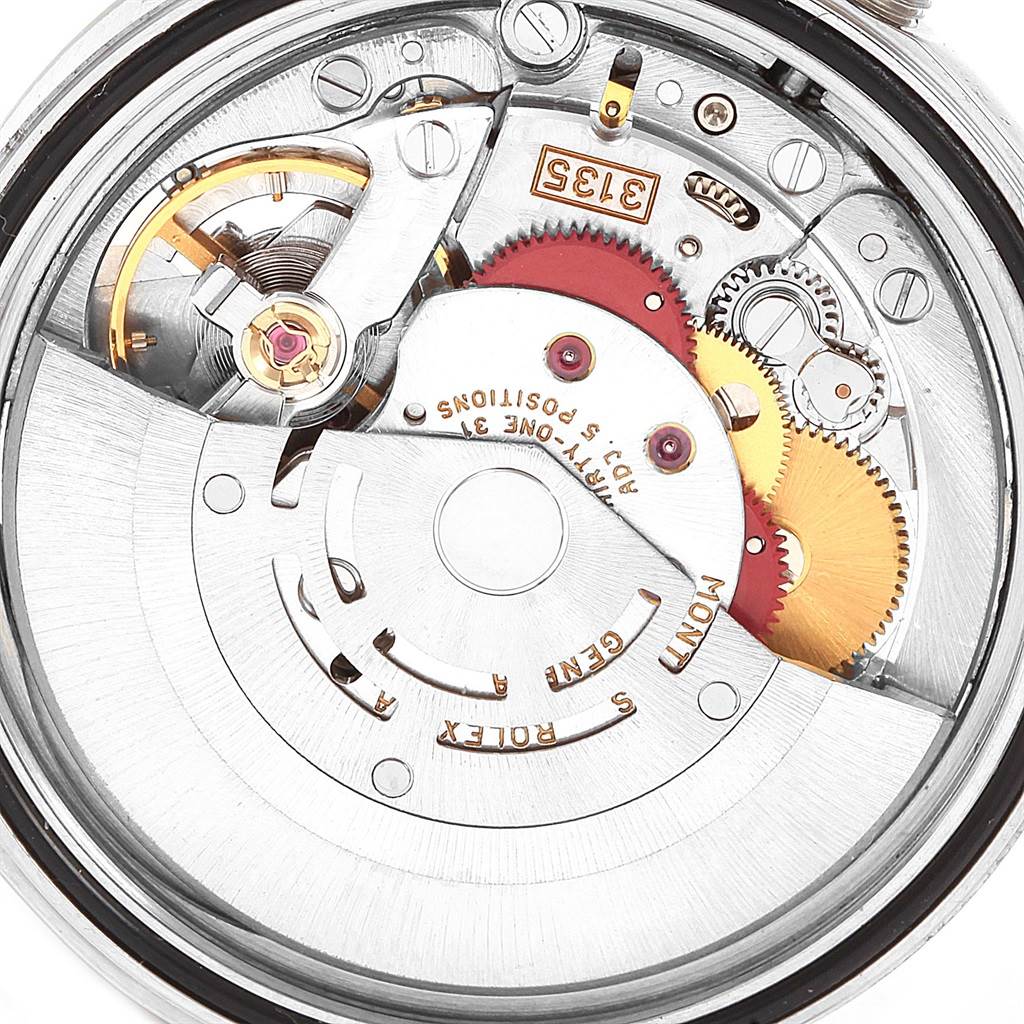 The image shows a close-up view of the intricate inner mechanics and gears of a Rolex Datejust 16233 Men's Steel and Gold (two tone) Beige Dial 16233 Men's Steel and Gold (two tone) Beige Dial watch.