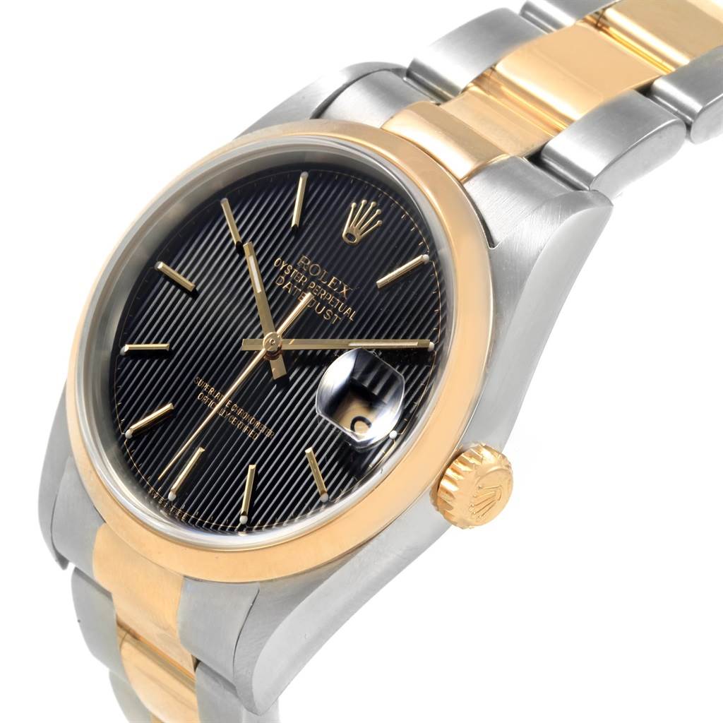 This image shows a Rolex Datejust 16203 Men's Steel and Gold (two tone) Black Dial 16203 Men's Steel and Gold (two tone) Black Dial watch from a slight angle, highlighting the dial, bezel, bracelet, and crown.