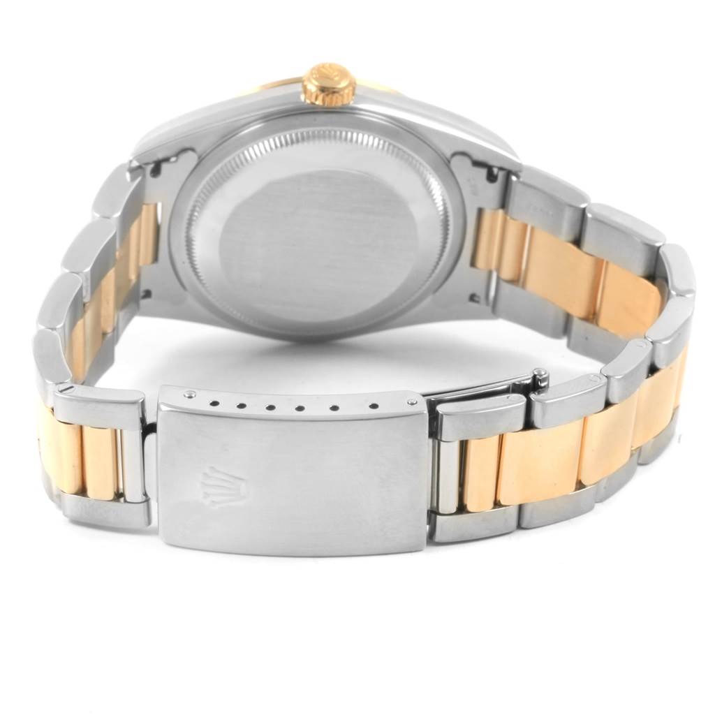 This photo shows the back and clasp of the Rolex Datejust 16203 Men's Steel and Gold (two tone) Black Dial 16203 Men's Steel and Gold (two tone) Black Dial watch with a two-tone bracelet.