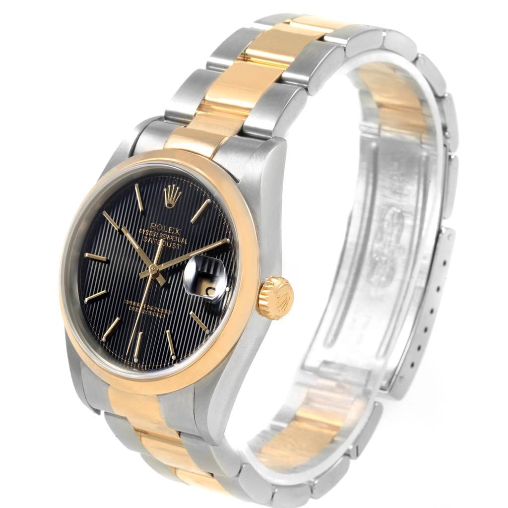 The Rolex Datejust 16203 Men's Steel and Gold (two tone) Black Dial 16203 Men's Steel and Gold (two tone) Black Dial watch is shown at a three-quarter angle, highlighting its face, bezel, crown, and bracelet.