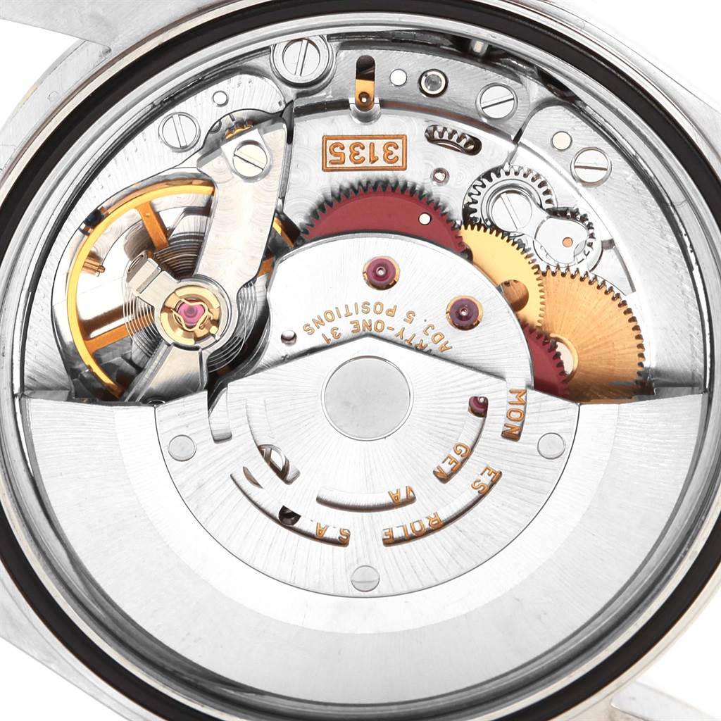 This image shows the intricate inner mechanism of a Rolex Datejust 16203 Men's Steel and Gold (two tone) Black Dial 16203 Men's Steel and Gold (two tone) Black Dial watch from a close-up, top-down angle.