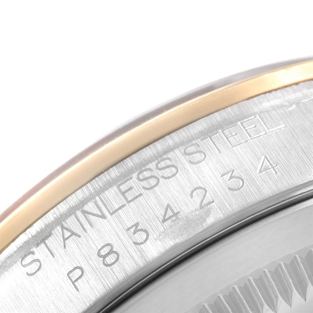 The image shows a close-up of the engraved text on the stainless steel case of a Rolex Datejust 16203 Men's Steel and Gold (two tone) Black Dial 16203 Men's Steel and Gold (two tone) Black Dial watch.