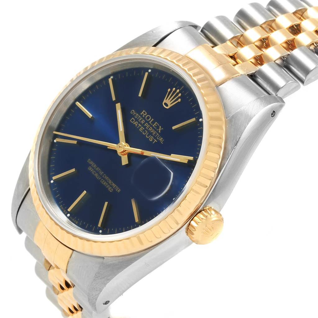 This image shows a Rolex Datejust 16233 Men's Steel and Gold (two tone) Blue Dial 16233 Men's Steel and Gold (two tone) Blue Dial watch at a slight angle, highlighting the dial, bezel, crown, and part of the bracelet.