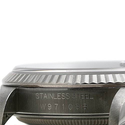 The image shows a close-up of the side view of a Rolex Datejust 16234 Men's Stainless Steel Black Dial 16234 Men's Stainless Steel Black Dial model, highlighting the stainless steel bezel and serial number.