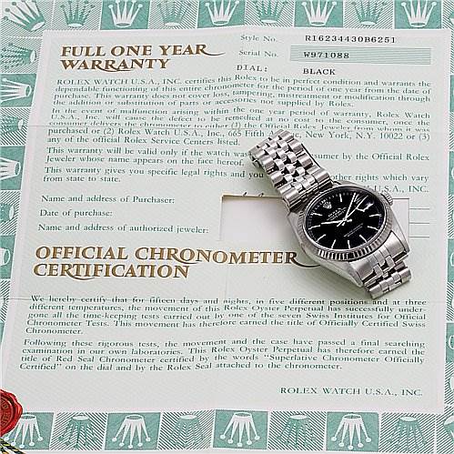 This image shows a Rolex Datejust 16234 Men's Stainless Steel Black Dial 16234 Men's Stainless Steel Black Dial watch placed on its warranty and chronometer certification.