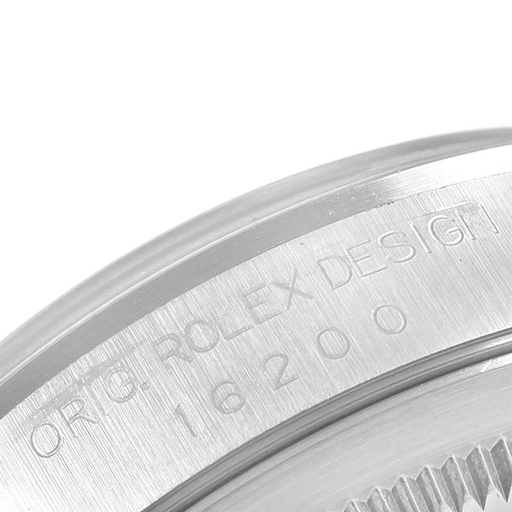 The image shows a close-up of the engraved case side of a Rolex Datejust 16200 Men's Stainless Steel Silver Dial 16200 Men's Stainless Steel Silver Dial model, focusing on the model number "16200."