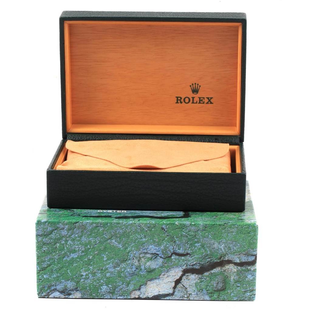 The image shows an open Rolex Datejust 16200 Men's Stainless Steel Silver Dial 16200 Men's Stainless Steel Silver Dial watch box with an inner wooden lining and a protective pouch inside.