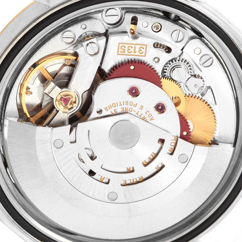 The image shows the internal mechanism of a Rolex Datejust 16233 Men's Steel and Gold (two tone) Black Dial 16233 Men's Steel and Gold (two tone) Black Dial watch, highlighting its intricate movement components.