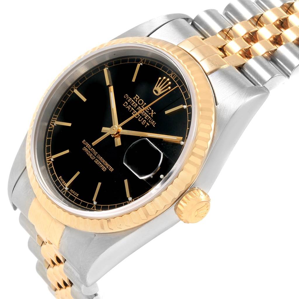 The image shows a close-up of the Rolex Datejust 16233 Men's Steel and Gold (two tone) Black Dial 16233 Men's Steel and Gold (two tone) Black Dial watch face, bezel, crown, and part of the two-tone bracelet at an angle.