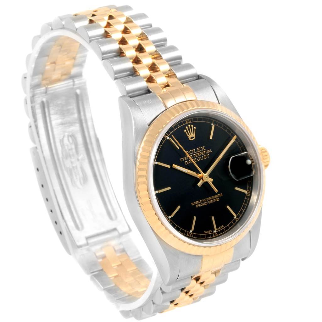This image shows a Rolex Datejust 16233 Men's Steel and Gold (two tone) Black Dial 16233 Men's Steel and Gold (two tone) Black Dial watch with a two-tone bracelet and fluted bezel, viewed at an angled perspective.