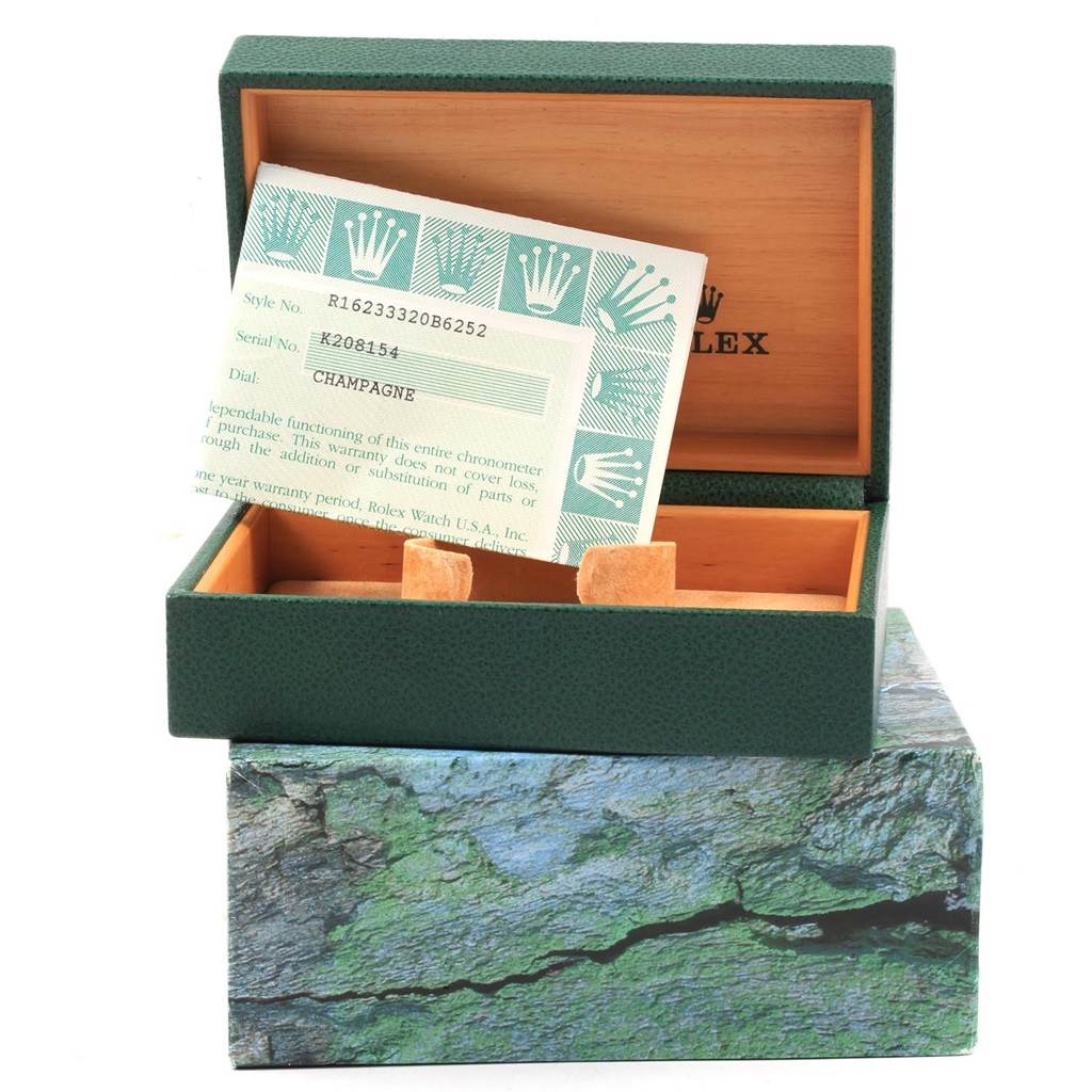 The image shows an open green Rolex box for the Datejust model, with a certification card displayed inside.