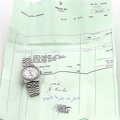 The Rolex Datejust 16220 Men's Stainless Steel White Dial 16220 Men's Stainless Steel White Dial watch is displayed lying flat on a receipt, showing the face and bracelet from a top-down angle.