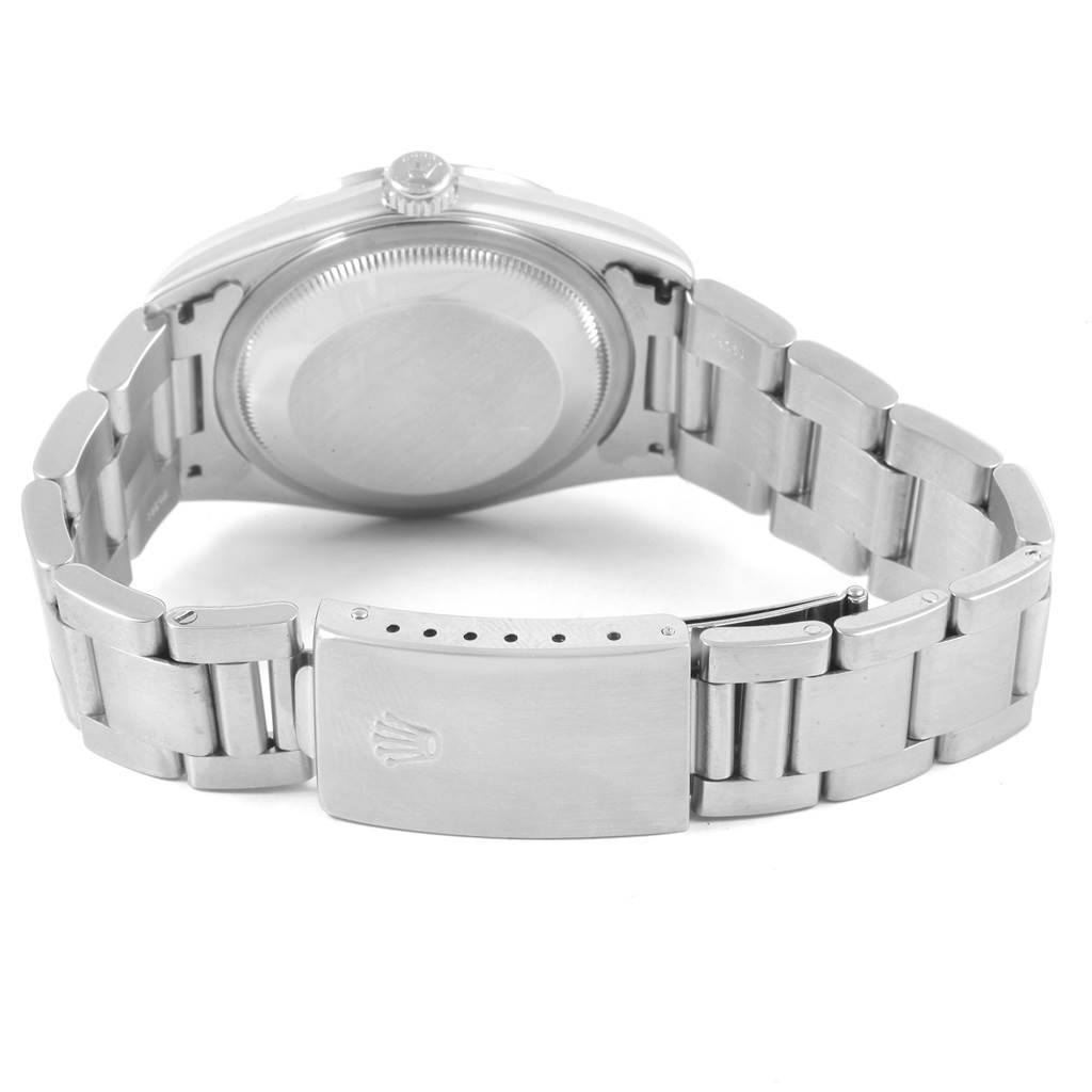The image shows the back view of a Rolex Datejust 16220 Men's Stainless Steel White Dial 16220 Men's Stainless Steel White Dial watch, highlighting the case back and the bracelet with the clasp.